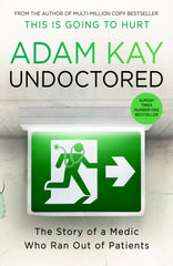 Undoctored by Adam Kay. Book cover has a photograph of a hospital corridor sign of a green person running through a door with a stethoscope.