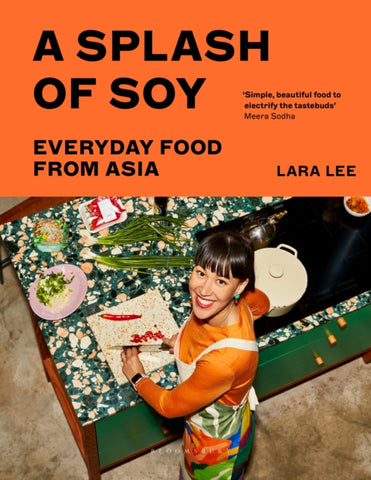 A Splash of Soy : Everyday Food from Asia by Lara Lee. Book cover has a colour photograph of the author preparing food on a table top.