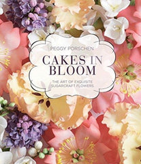 Cakes in Bloom : The art of exquisite sugarcraft flowers by Peggy Porschen. Book cover has a colour photograph of various sugar craft flowers.