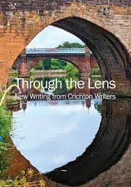 Through The Lens: New Writing From Crichton Writers. Book cover has a photograph of two bridges with their reflections in the river.